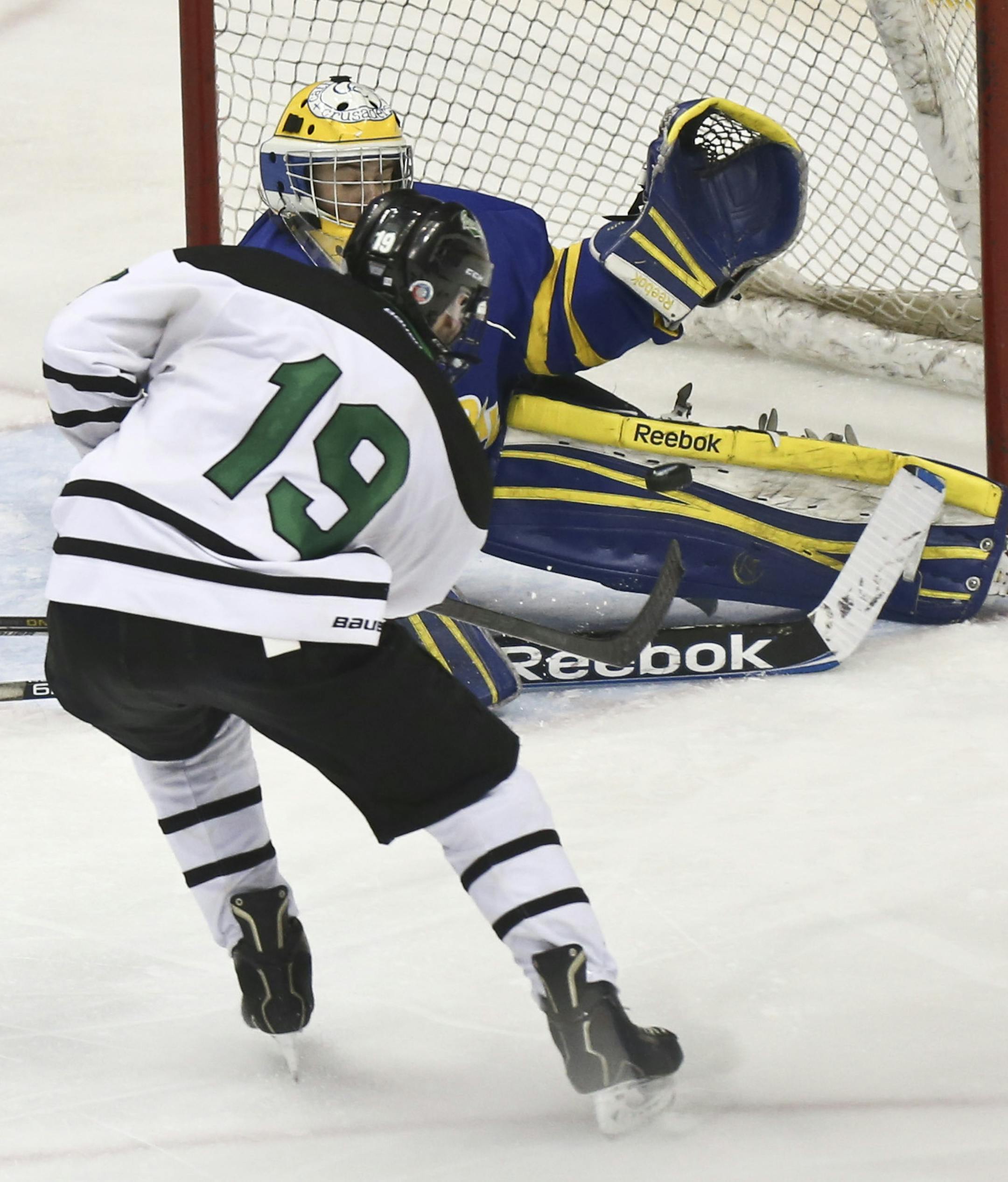 East Grand Forks' Tanner Tweten scored the winning point on St. Cloud Cathedral goalie Zach Fritz in the third period during the State Boys hockey Tournament 1A semifinals between St. Cloud Cathedral and East Grand Forks in St. Paul, Minn., on Friday, March 7, 2014. East Grand Forks won 2-1. ] (RENEE JONES SCHNEIDER &#x2022; reneejones@startribune.com)