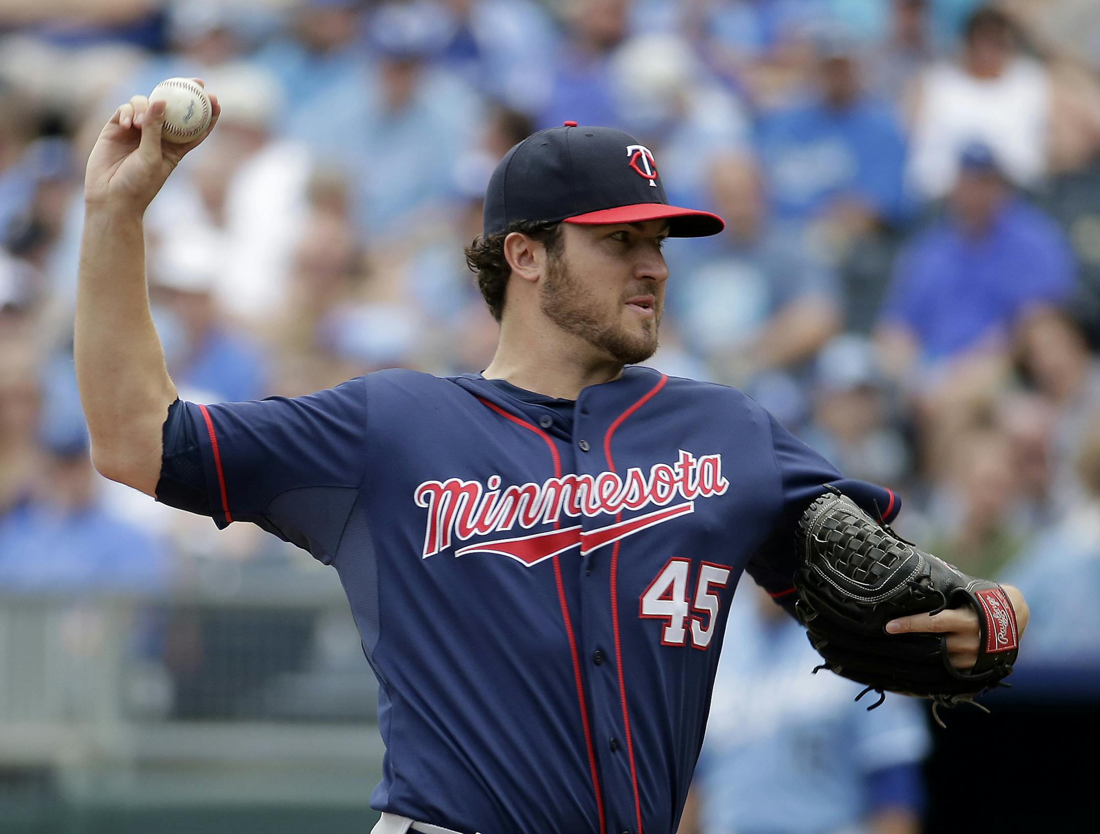 CORRECTS TO PITCHER PHIL HUGHES NOT SCOTT ULLGER - Minnesota Twins pitcher Phil Hughes throws during the first inning of a baseball game against the Kansas City Royals, Sunday, April 20, 2014, at Kauffman Stadium in Kansas City, Mo. (AP Photo/Charlie Riedel)