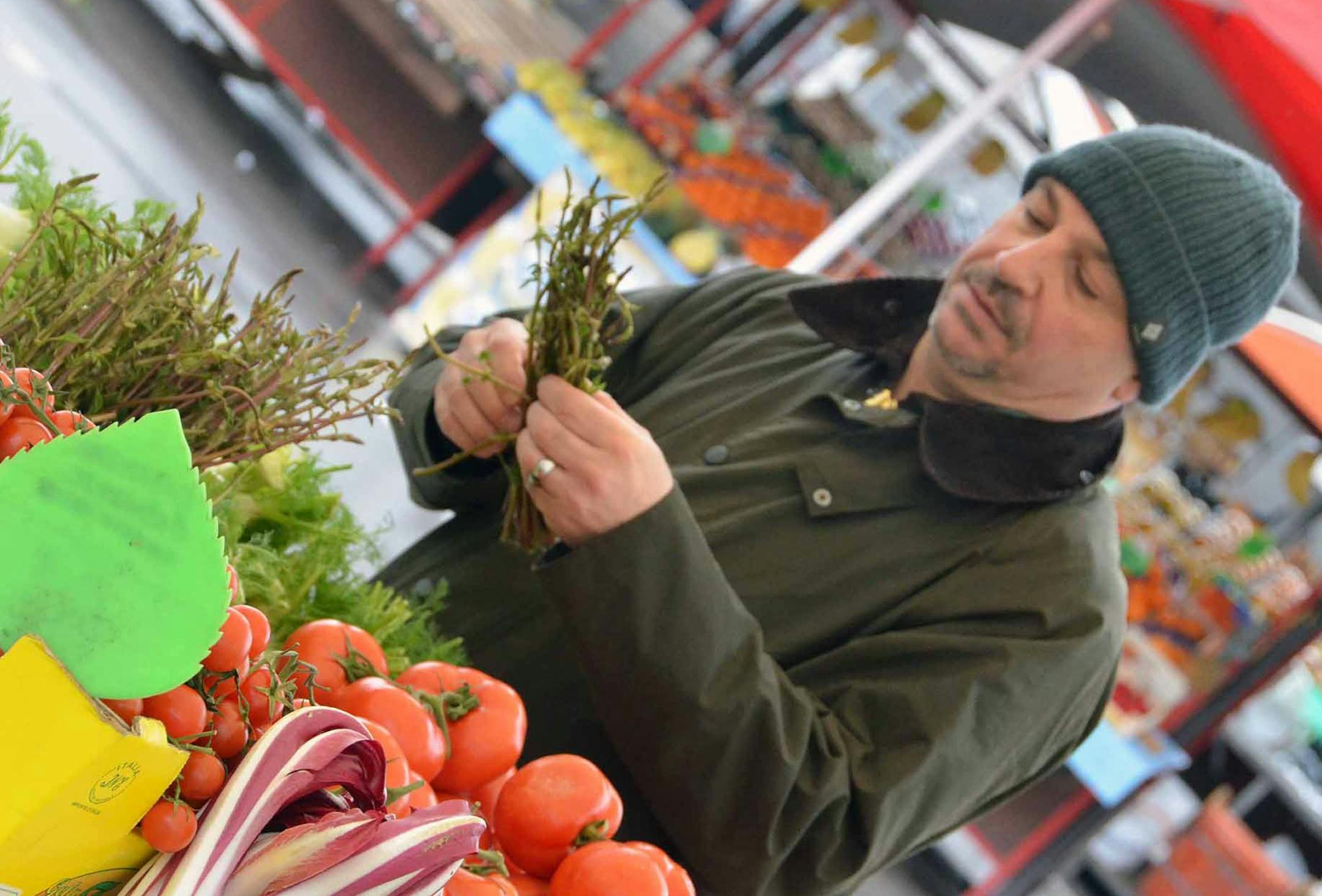 Photos by Christopher Wurst Lenny Russo at the market on a rainy day in Slovenia.
