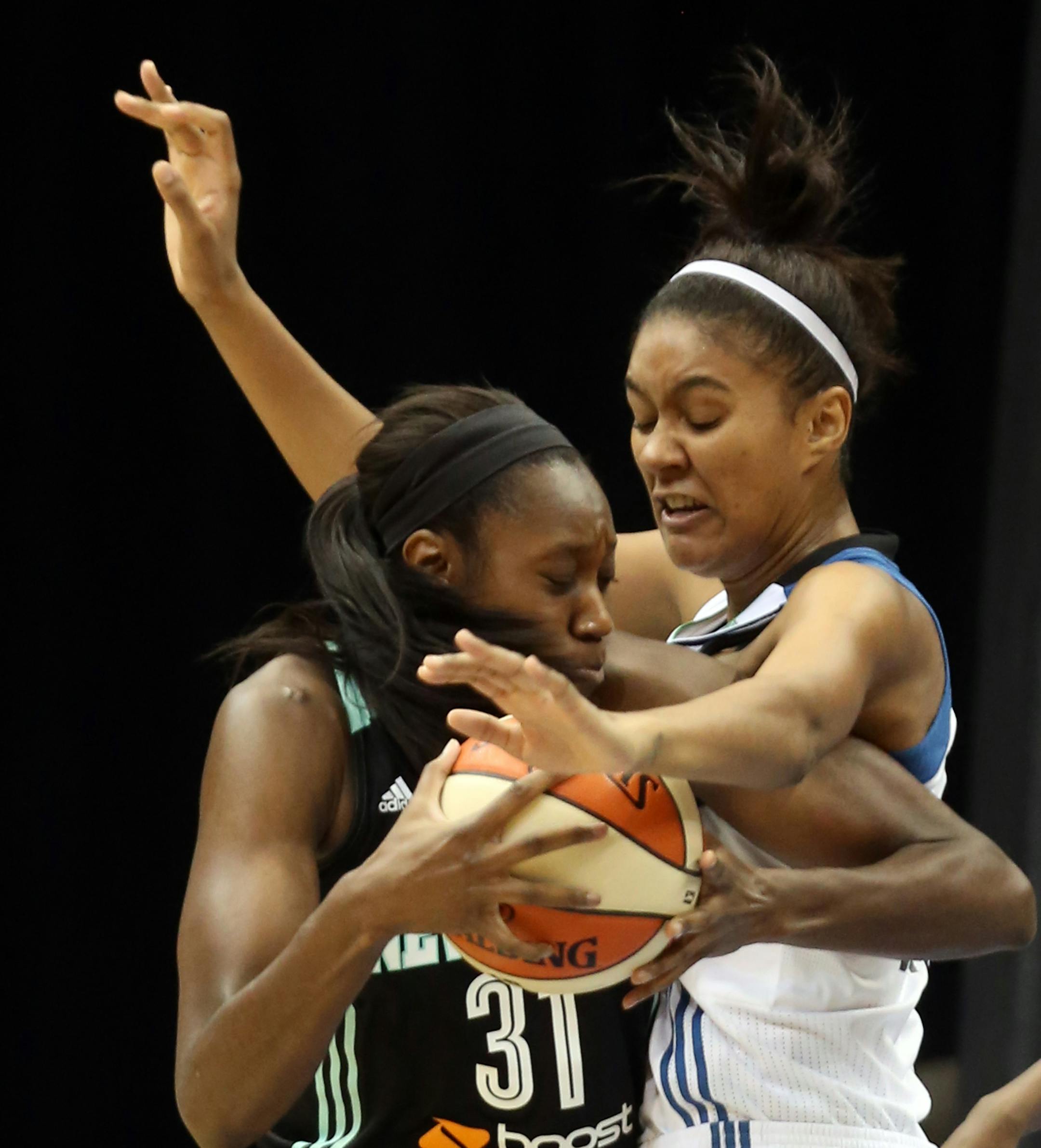 Lynx Damiris Dantas and Liberty's Tina Charles fought over a rebound during the first half. ] (KYNDELL HARKNESS/STAR TRIBUNE) kyndell.harkness@startribune.com Lynx vs New York Liberty at the Target Center in Minneapolis Min. Saturday, May 24, 2014.