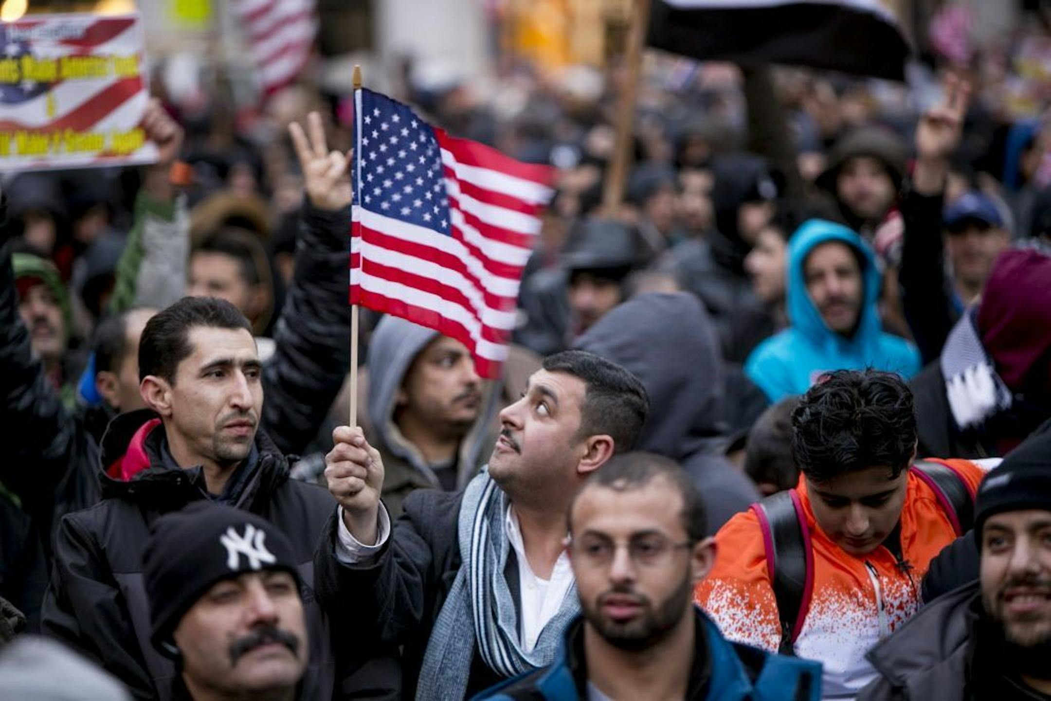 Protesters, including many proprietors of Yemeni-owned businesses, demonstrate against President Donald Trump's executive order barring immigration from 7 Muslim-majority countries, including Yemen, outside Brooklyn Borough Hall in New York, Feb. 2, 2017. Hundreds of small neighborhood Yemeni-owned shops and bodegas closed for the day to protest the executive order.