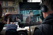 Director Patrick Coyle watched a monitor as actor Adam Bartley worked a scene in a St. Paul backyard on Feb. 6. A production crew has been filming "Un