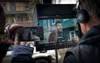 Director Patrick Coyle watched a monitor as actor Adam Bartley worked a scene in a St. Paul backyard on Feb. 6. A production crew has been filming "Un