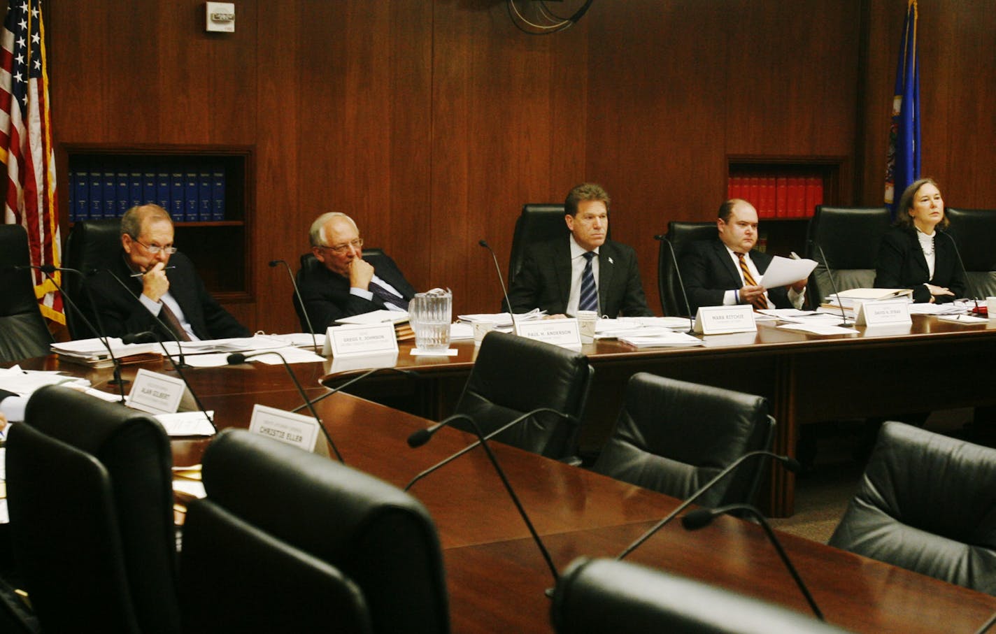 Members of the canvassing board listen to counsel testimony on frivilous challenges. Among the members are second district Judge Gregg E. Johnson, left to right, state supreme court justice Paul H. Anderson, secretary of state Mark Ritchie, state supreme court justice David Stras and fourth judicial district assistant chief judge Denise Reilly.