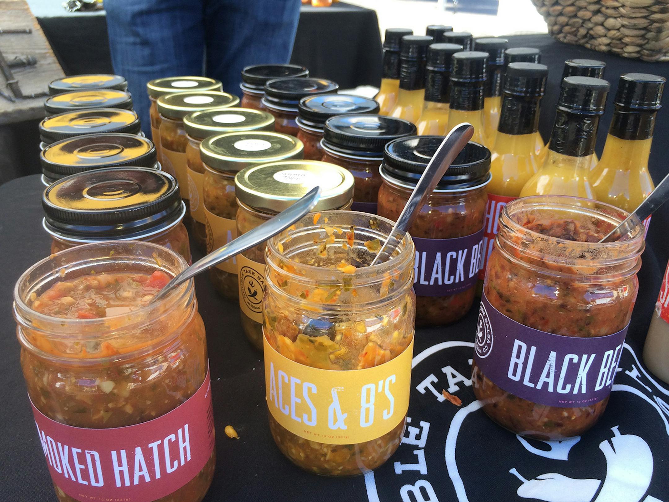 Products at the Heat Up Your Life event included, from left: Brendan Draves’ Ouch Powder, Bernie Dahlin’s Double Take brand of sauces and spiced nuts from Tasya Kelen’s Isadore Nut Co.