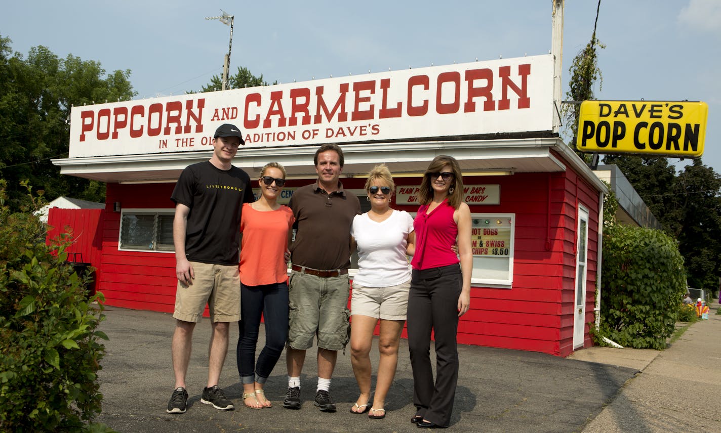 From left to right: Ben Boldenow, 22, Olivia Neary, 21, Andrew Neary, Sherri Shannon-Neary, and Hillary Neary, 22, run Dave's Popcorn in Minneapolis, Minn. Andrew and Sherri recently put Dave's up for sale as the family was too busy with their full-time jobs to keep it going.] KAYLEE EVERLY kaylee.everly@startribune.com