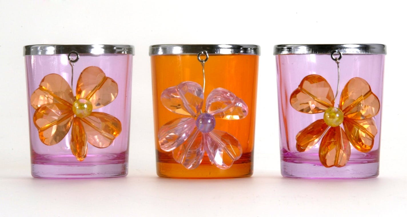 Metal-rimmed pink and orange votives with removable dangling heart-shaped glass and bead flowers.