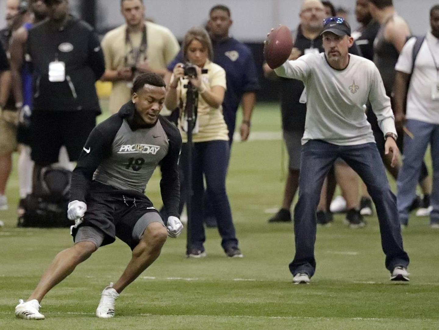 Central Florida's Mike Hughes, front left, performs a drill during a drill at UCF's Pro Day, Thursday, March 29, 2018, in Orlando, Fla. Pro day is intended to showcase talent to NFL scouts for the upcoming draft.