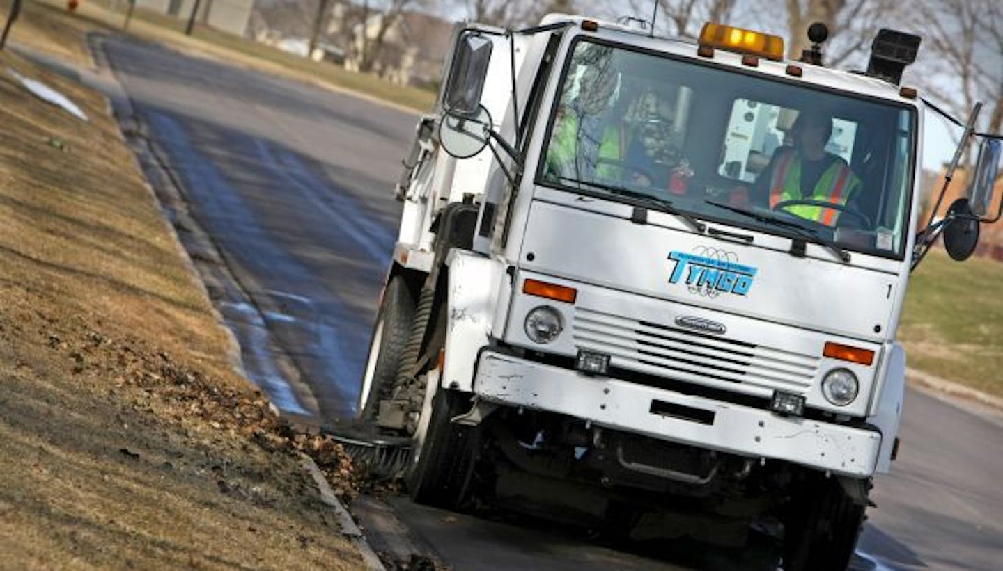 A crew from Carefree Services, which has a contract with the city of Plymouth to sweep streets, used an air sweeper to clean near the intersection of 21st Street and Fernbrook Lane.