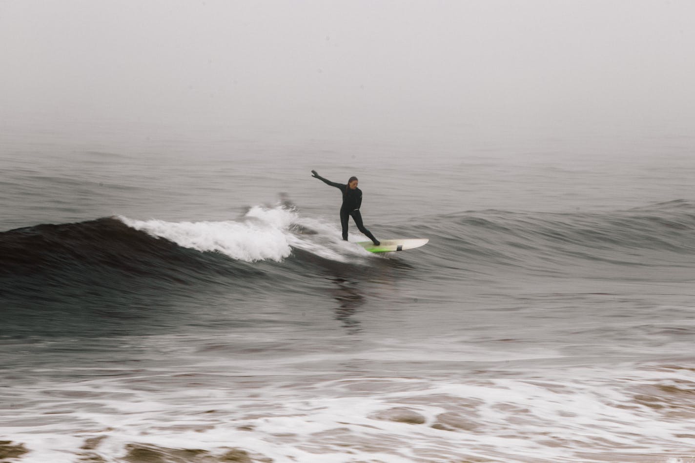 -- PHOTO MOVED IN ADVANCE AND NOT FOR USE - ONLINE OR IN PRINT - BEFORE MAY 31, 2015. -- A surfer catches a wave at the 91st Street breaks at Rockaway Beach in New York, May 12, 2015. What started as a diversion, a leisure activity to help fill empty hours, became a kind of organizing principle that guided the choices of a 50-year-old. (Christopher Gregory/The New York Times) ORG XMIT: XNYT91