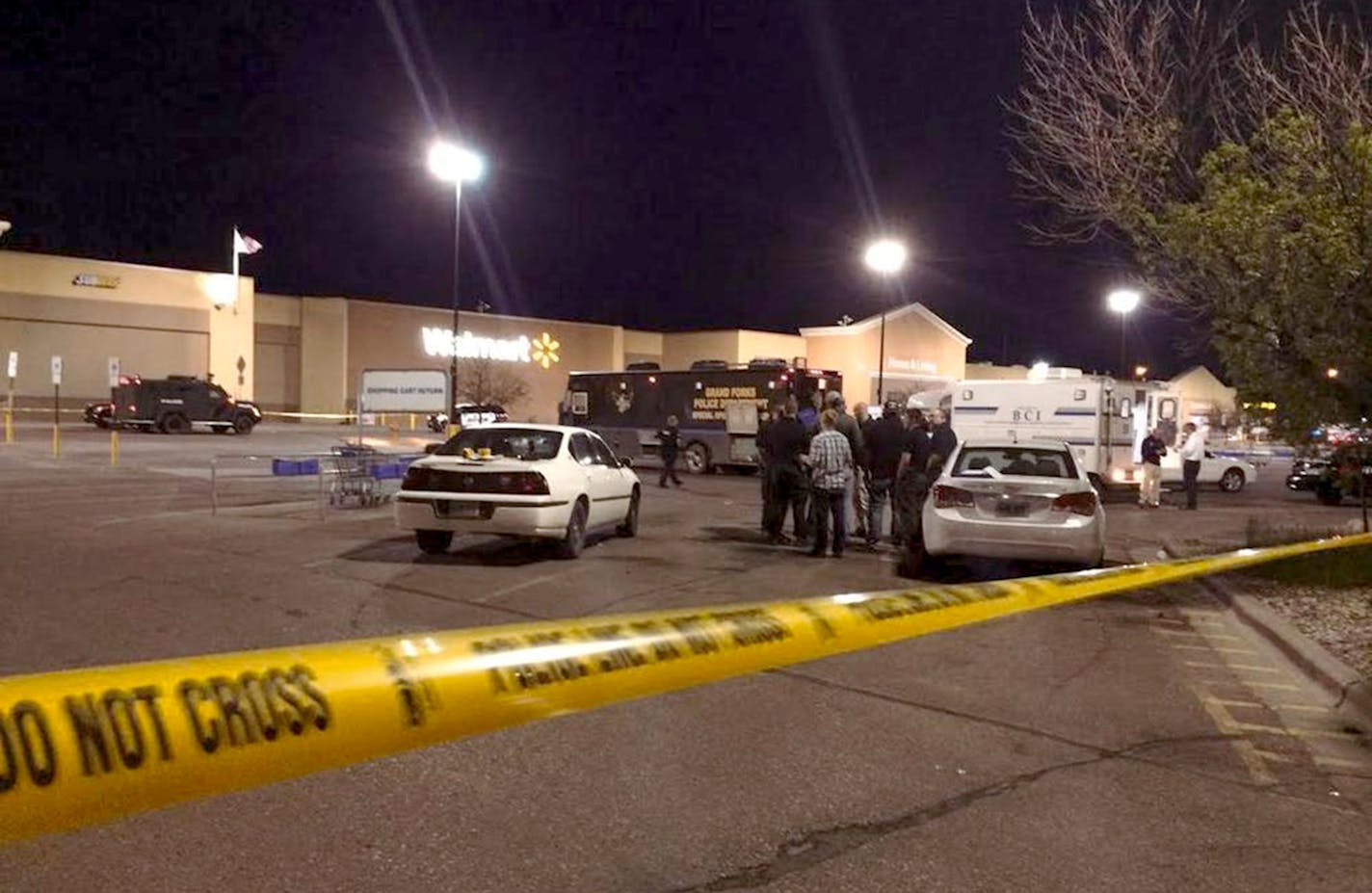 Law enforcement officers patrol the scene of a shooting at Wal-Mart on Tuesday, May 26, 2015, in Grand Forks, N.D. (credit - WDAY TV News )