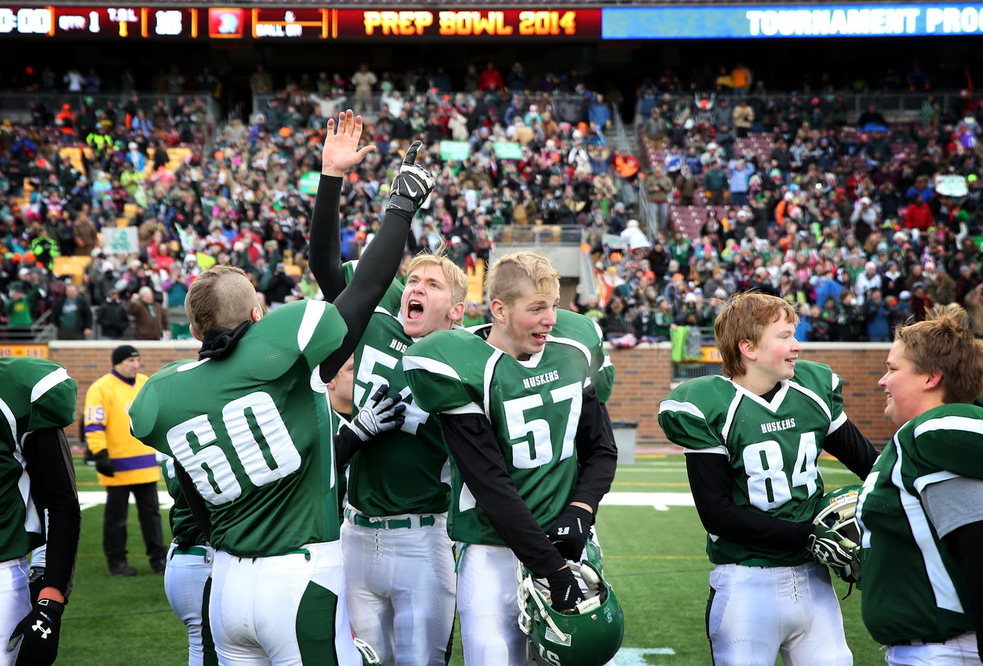 Holdingford players celebrate their double overtime win over BOLD in the 2A State Championships. ] LEILA NAVIDI leila.navidi@startribune.com / BACKGROUND INFORMATION: BOLD and Holdingford face off in the 2A State Championship game at TCF Bank Stadium in Minneapolis on Friday, November 21, 2014.