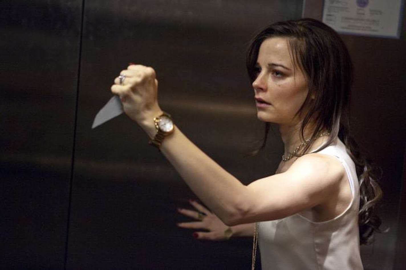 Bojana Novakovic in, "Devil". In the film, a group of people is trapped in the elevator, and one of them is the Devil.