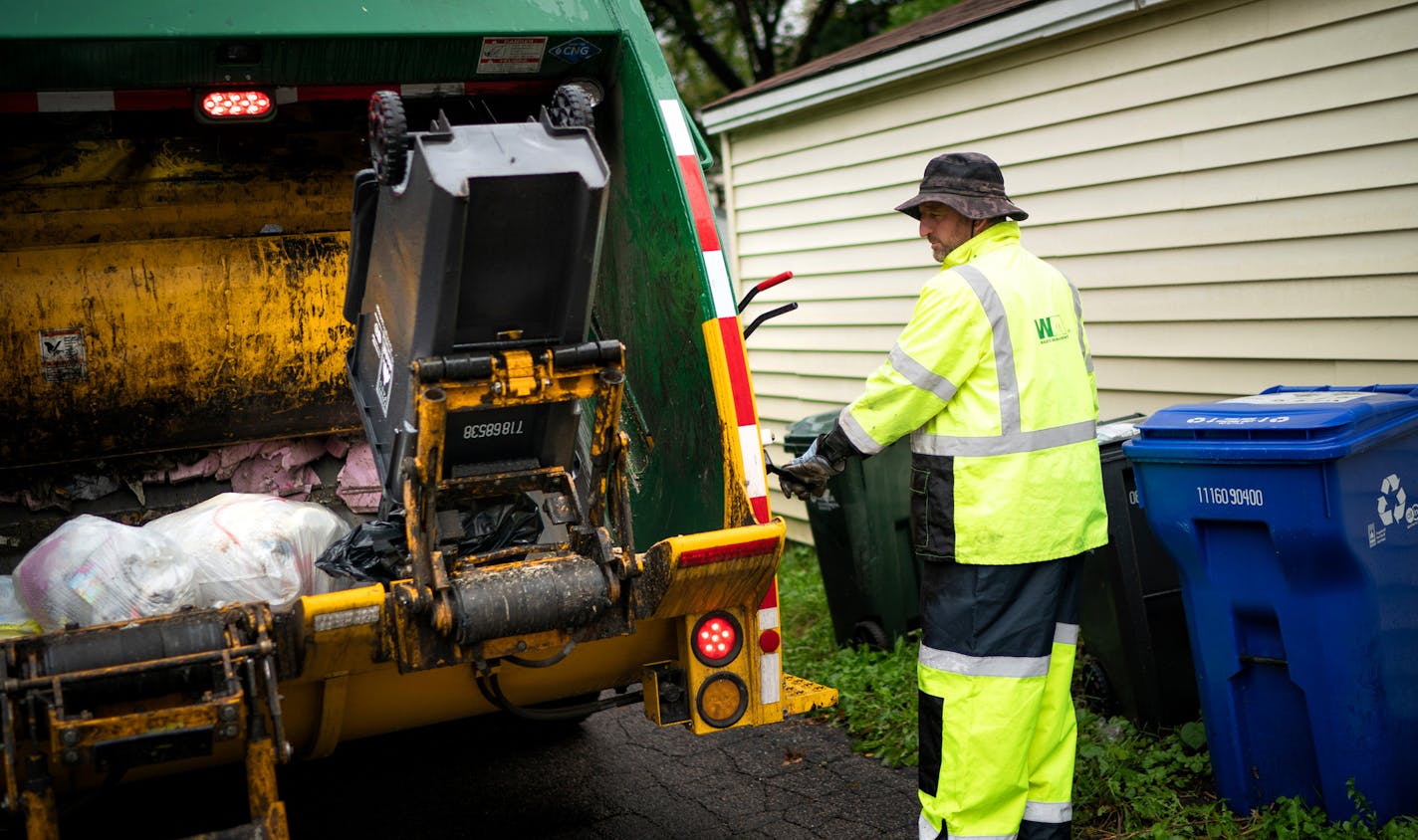 Waste Management worker Daniel Westerhaus collected trash from the alleys of the Snelling Hamline neighborhood of St Paul's yellow zone on the first day of organized trash collection. ] GLEN STUBBE &#x2022; glen.stubbe@startribune.com Monday, October 1, 2018 St. Paul has begun its organized trash collection, a dramatic shift in how the city collects its waste. Scattered reports of residents using the wrong bins, but so far no major snafus. What's Happening at this time: Organized trash collectio