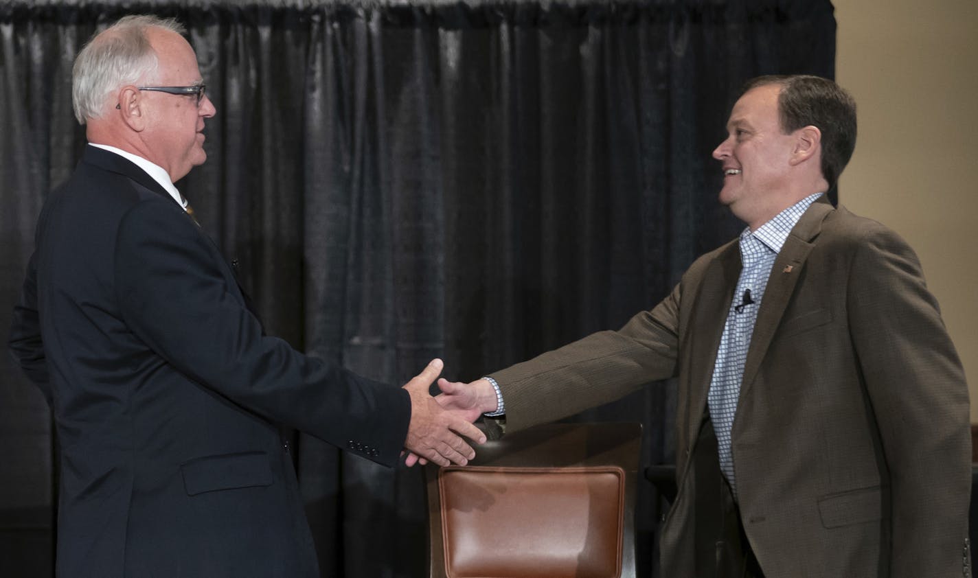 FILE - In this Aug. 17, 2018 file photo, candidates for Minnesota governor, Democrat Tim Walz and Republican Jeff Johnson shake hands at the beginning of their first debate at Grand View Lodge, Nisswa, Minn. (Glen Stubbe /Star Tribune)