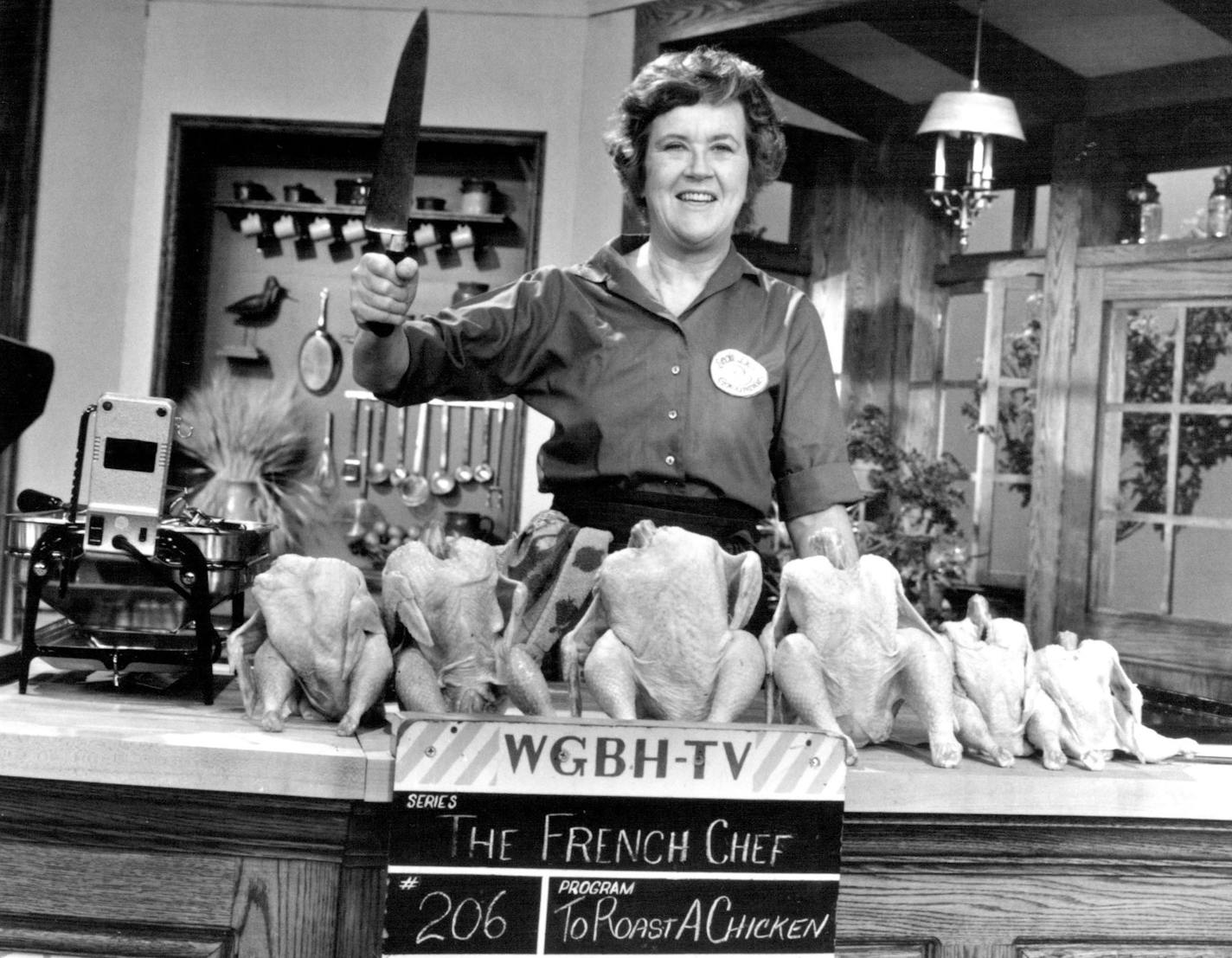 March 13, 1993 Critic's choice SUNDAY/ "A Birthday Tribute to Julia Child - Compliments to the Chef" (3:30 p.m., KTCA-Ch. 2) celebrates public TV's first bona fide star with music, reminiscences, recipe demonstrations and even the infamous "Saturday Night Live" sketch with Dan Ackroyd as a "gushing" Julia-The AMC Film Preservation Festival continues with, among other movies, 1930's "The Big Trail" (9:30 a.m., AMC), in which John Wavne had his first Major-movie starring role... 1970 Paul Child