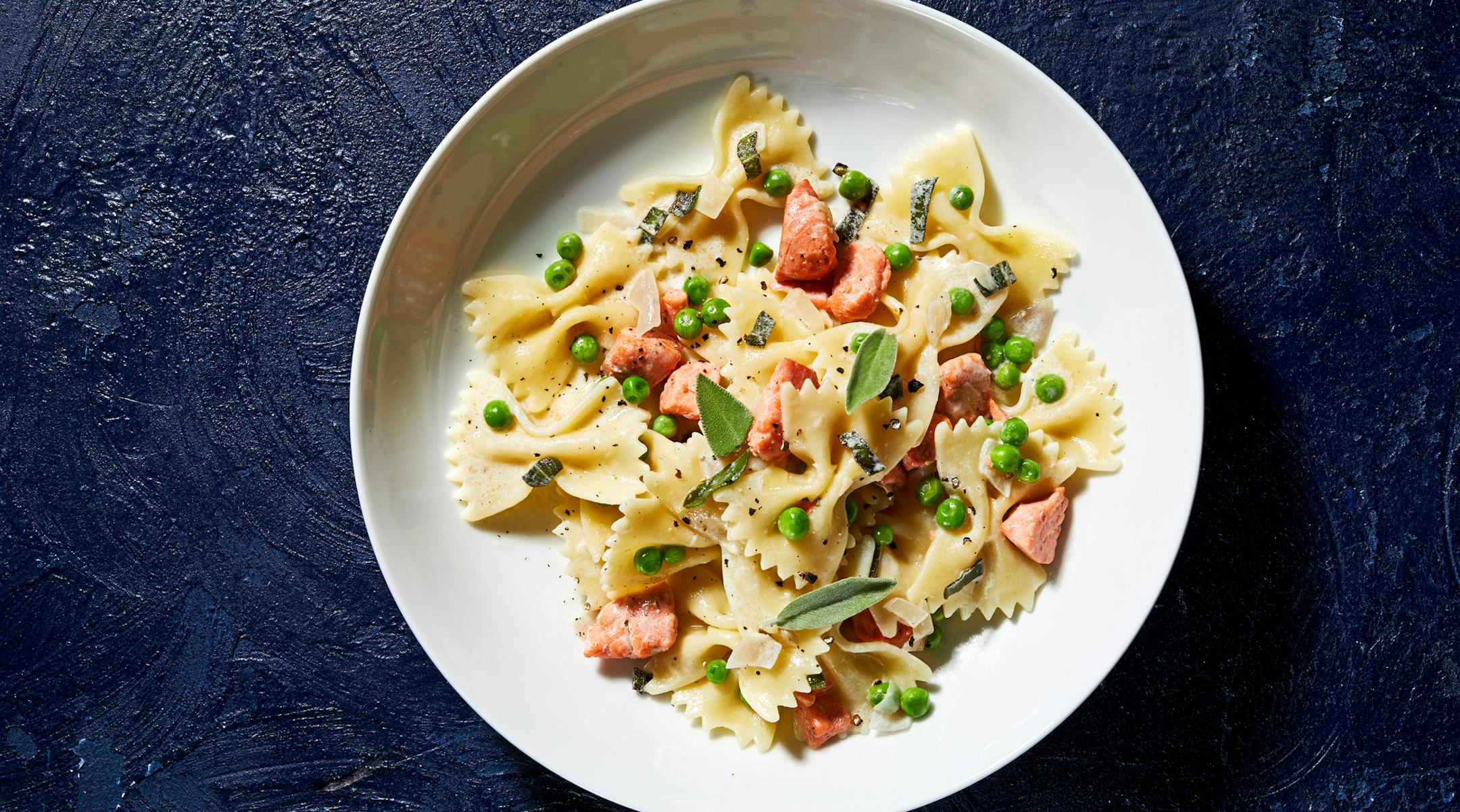 Farfalle With Salmon, Peas and Sage. MUST CREDIT: Photo by Stacy Zarin Goldberg for The Washington Post. Food styling by Lisa Cherkasky for The Washington Post.