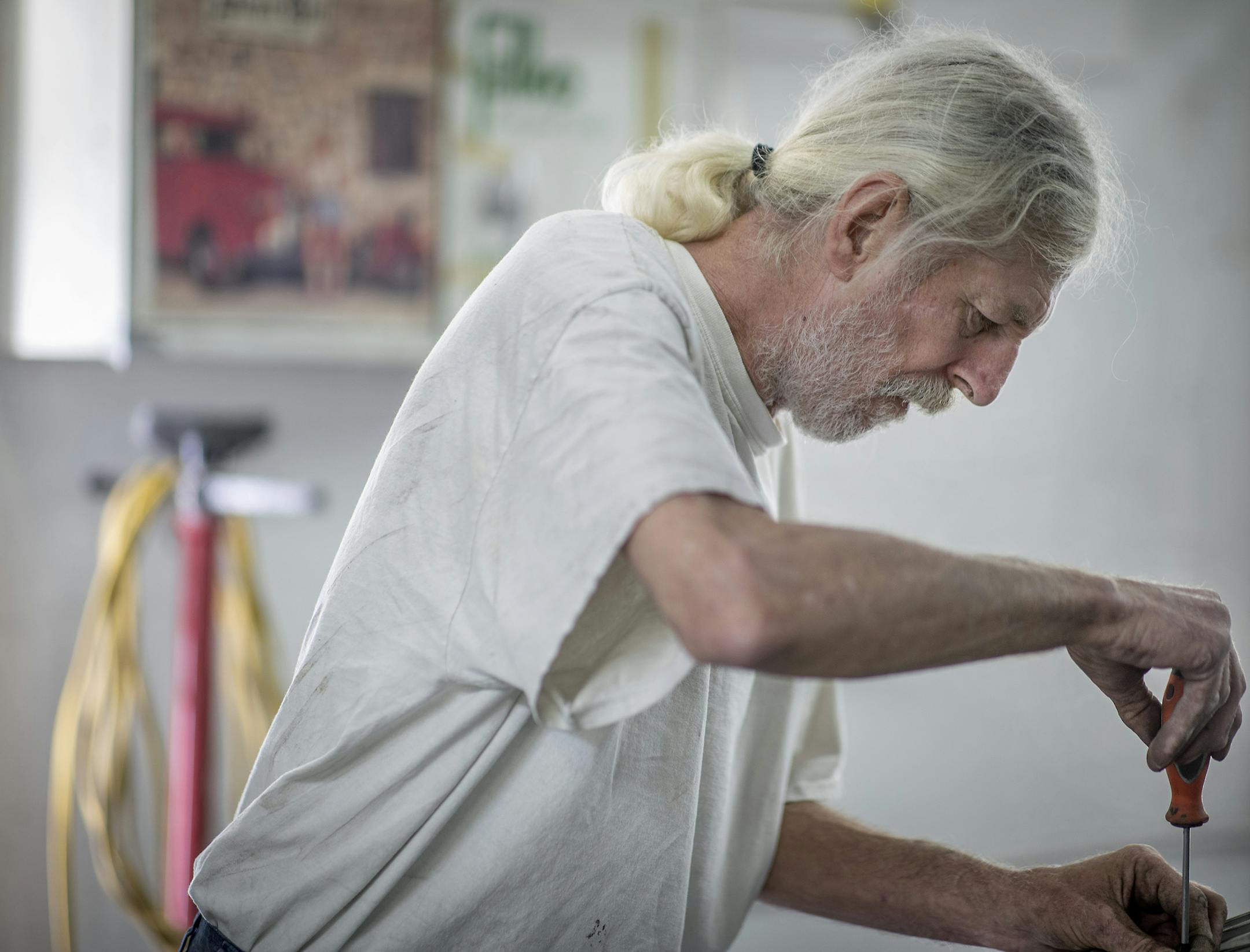 Employees such as Tom Procai, who's been with New Central Auto Body for 43 years, have made a difference at the shop — and the neighborhood.