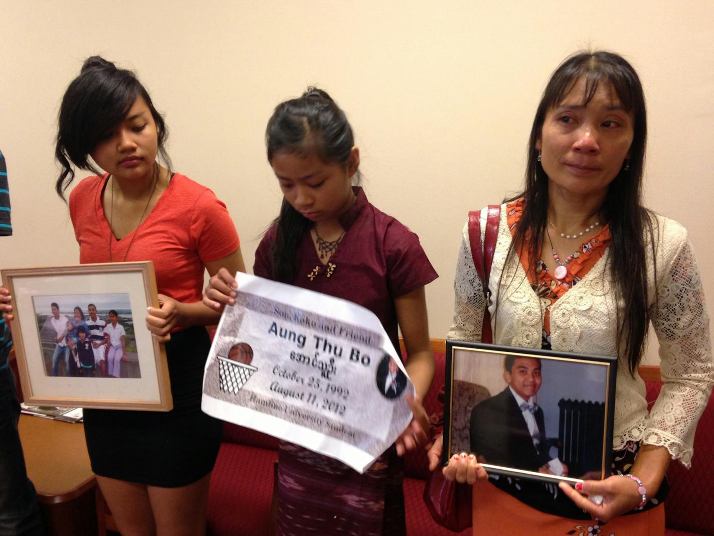 (From L to R) Thanda, Amy and their mother, Thanthan Bo, remember their brother and son, Aung Thu Bo, following the sentencing Wednesday morning of his murderer. Bo was lured into a robbery by a false Craigslist ad advertising an iPhone.