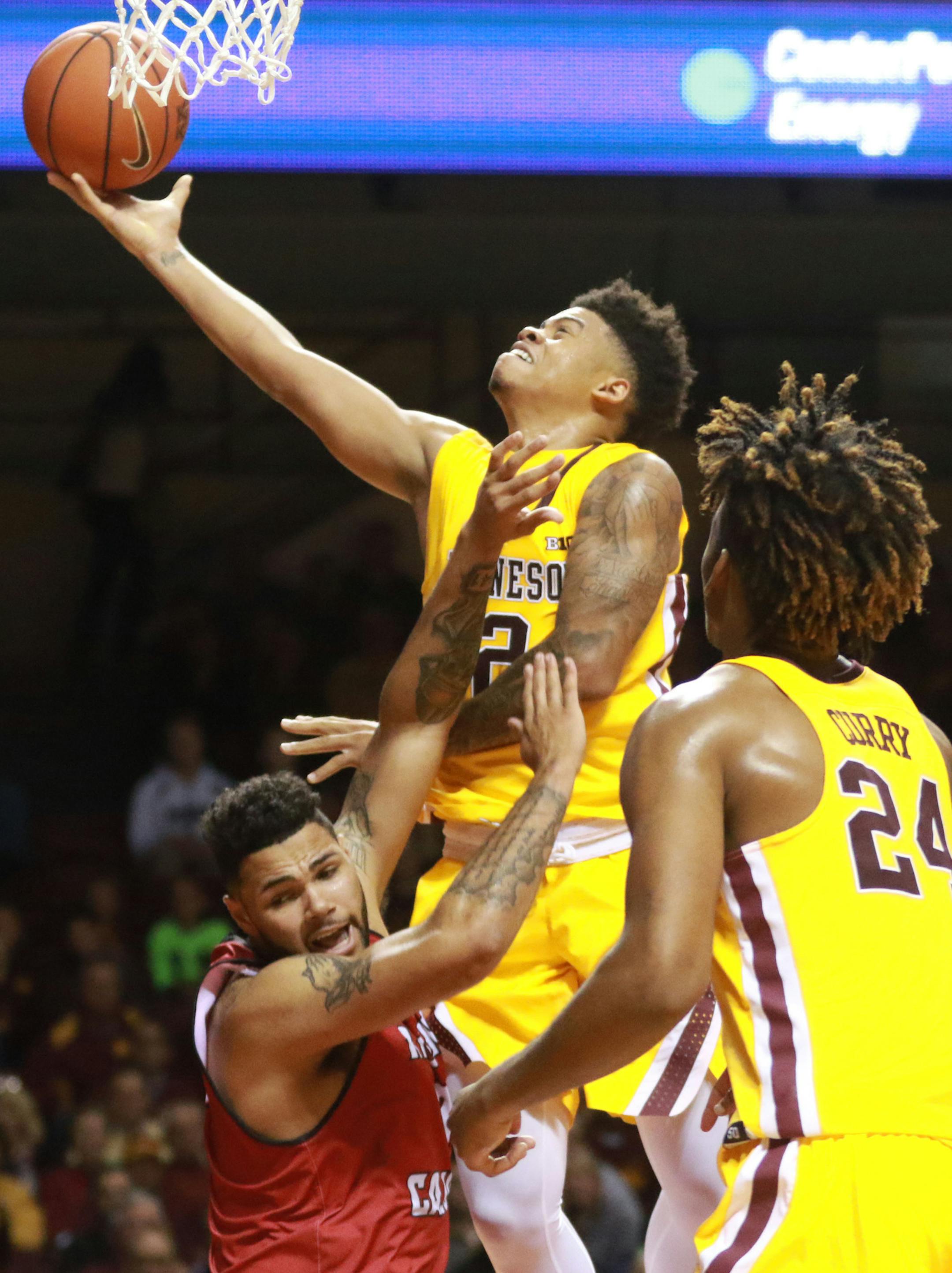 The University of Minnesota's Nate Mason (2) is fouled by La.-Lafayette's Justin Miller (3) while driving to the basket during the second half of the Gophers 86-74 win Friday, Nov. 11, 2016, at Williams Arena on the University of Minnesota campus in Minneapolis, MN.] (DAVID JOLES/STARTRIBUNE)djoles@startribune.com Gophers game vs. La.-Lafayette