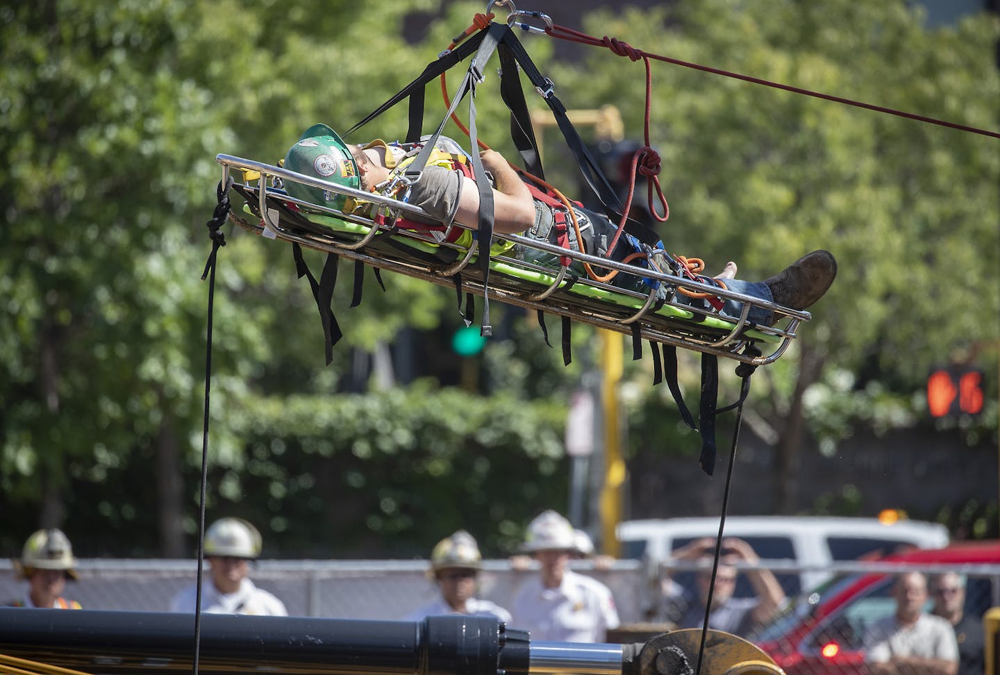 Minneapolis and St. Paul firefighters and a structural rescue team worked more than 3 hours to rescue a construction worker at a site on the corner of Park Street and Washington Avenue, Monday, July 29, 2019 in Minneapolis, MN. ] ELIZABETH FLORES &#x2022; liz.flores@startribune.com