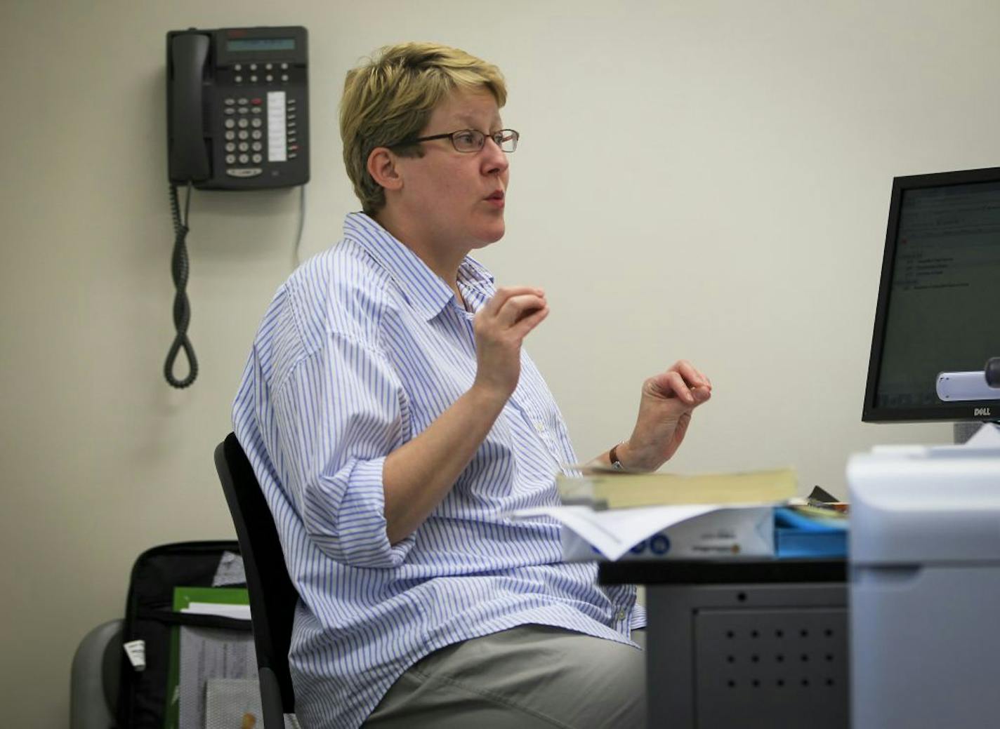 Kelly Dale spoke to the students in her advanced medical coding class at St. Paul College on Wednesday, June 20, 2012 in St. Paul, Minn.