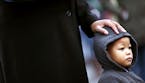 Tina Beavers placed her hand on 2-year grandson Kyeree Beavers head during church services in front of the 4th precinct Sunday November 29, 2015 in Mi