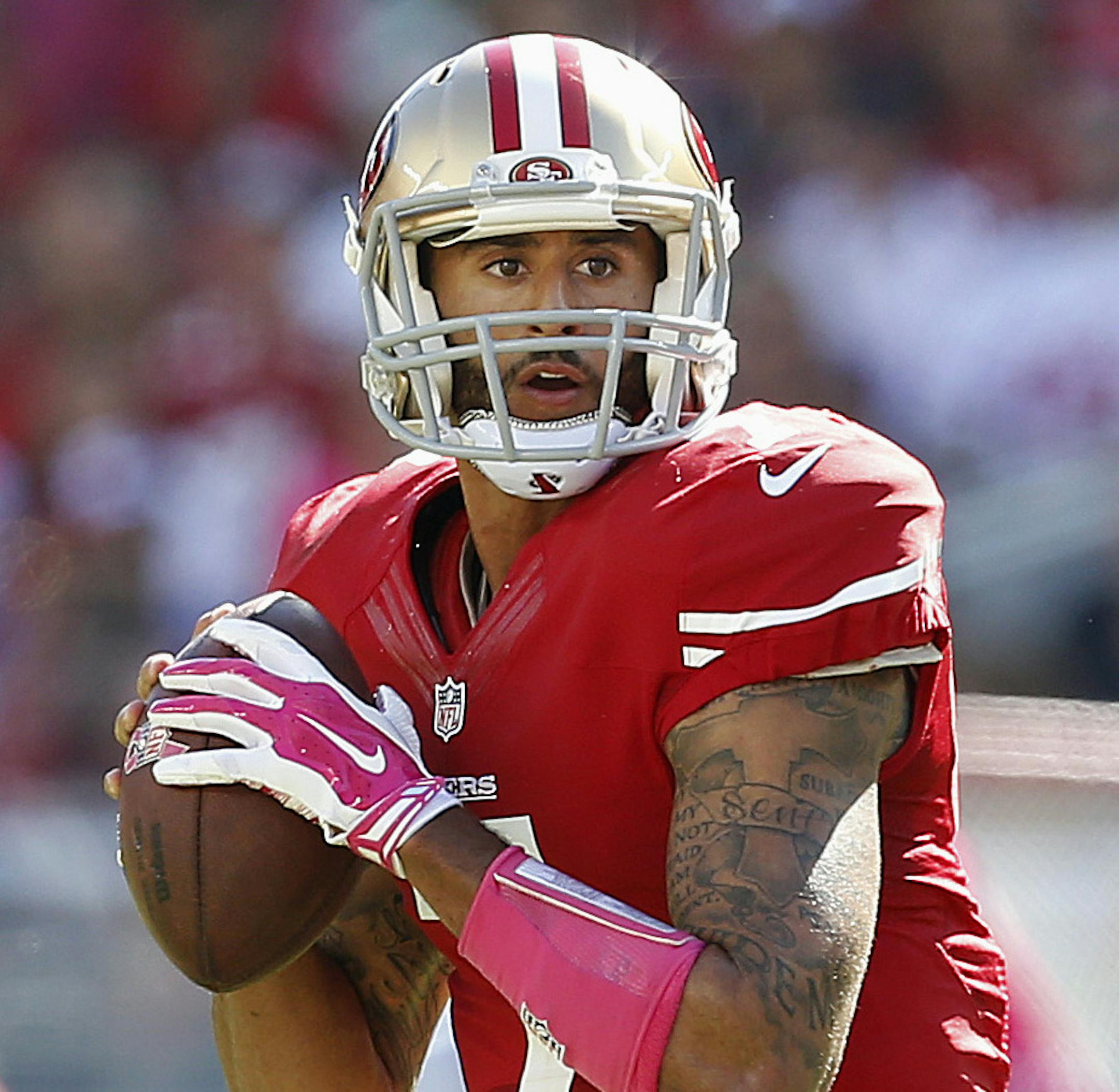 San Francisco 49ers quarterback Colin Kaepernick (7) passes as offensive tackle Alex Boone (75) blocks during the first half of an NFL football game against the Kansas City Chiefs in Santa Clara, Calif., Sunday, Oct. 5, 2014. (AP Photo/Tony Avelar)