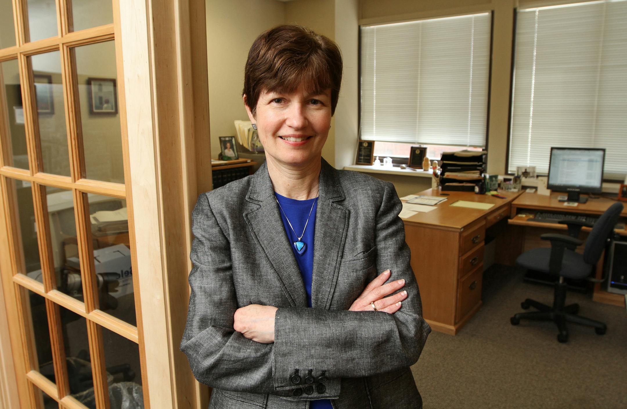 Former business lawyer Cathy Haukedahl, executive director of Mid-Minnesota Legal Aid. Mid-Minnesota Legal Aid relies increasingly on private donations and assistance from private attorneys and lawfirms to fulfill its century-old mission of providing legal service to the indigent and immigrants. She was photographed at her office in downtown Minneapolis on 5/16/13.] Bruce Bisping/Star Tribune bbisping@startribune.com Cathy Haukedahl/source.