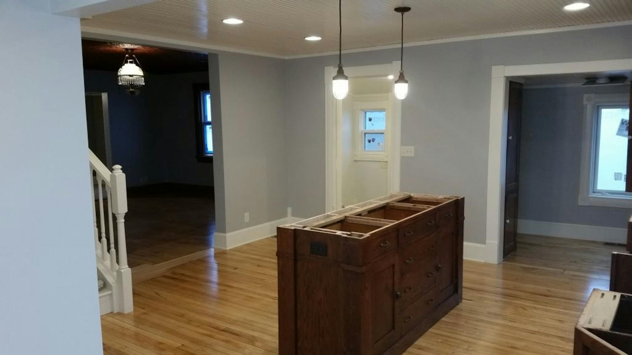 The bottom part of an antique hutch salvaged from Bauer Brothers was built into the new kitchen center island.