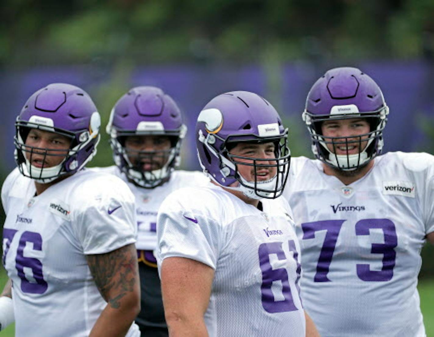 Minnesota Vikings' Brett Jones (61) practices at the NFL football teams practice facility in Eagen, Minn., Monday, Aug. 27, 2018. Vikings center Pat Elflein was held out of the entire preseason while rehabbing from ankle and shoulder surgeries, putting his availability for the opener in doubt. If he's not cleared to play, either Brett Jones or Danny Isidora would snap the ball to Kirk Cousins. (Brian Peterson/Star Tribune via AP)