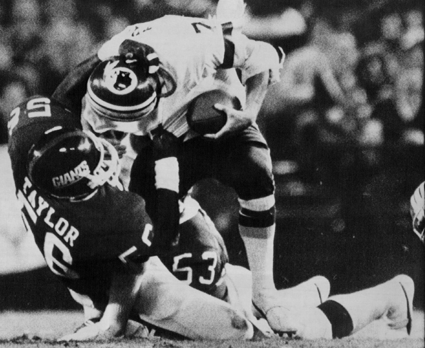 Lawrence Taylor brought down quarterback Joe Theismann in November 1985. Associated Press