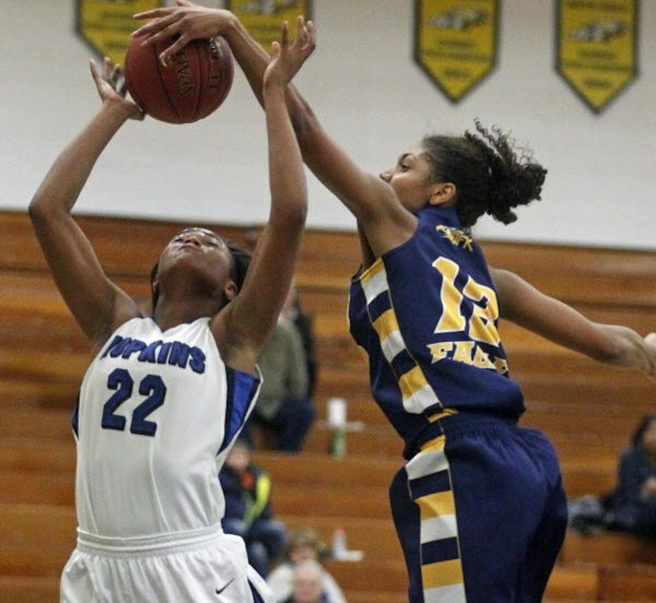 T.T. Starks of Hopkins had her shot blocked by Bloomington Kennedy's Jade Martin when the teams played last week at Kennedy. Hopkins, the defending Class 4A state champions, narrowly beat the Eagles, though Martin scored 24 points. Photo by Richard Tsong-Taatarii • rtsongtaatarii@startribune.com
