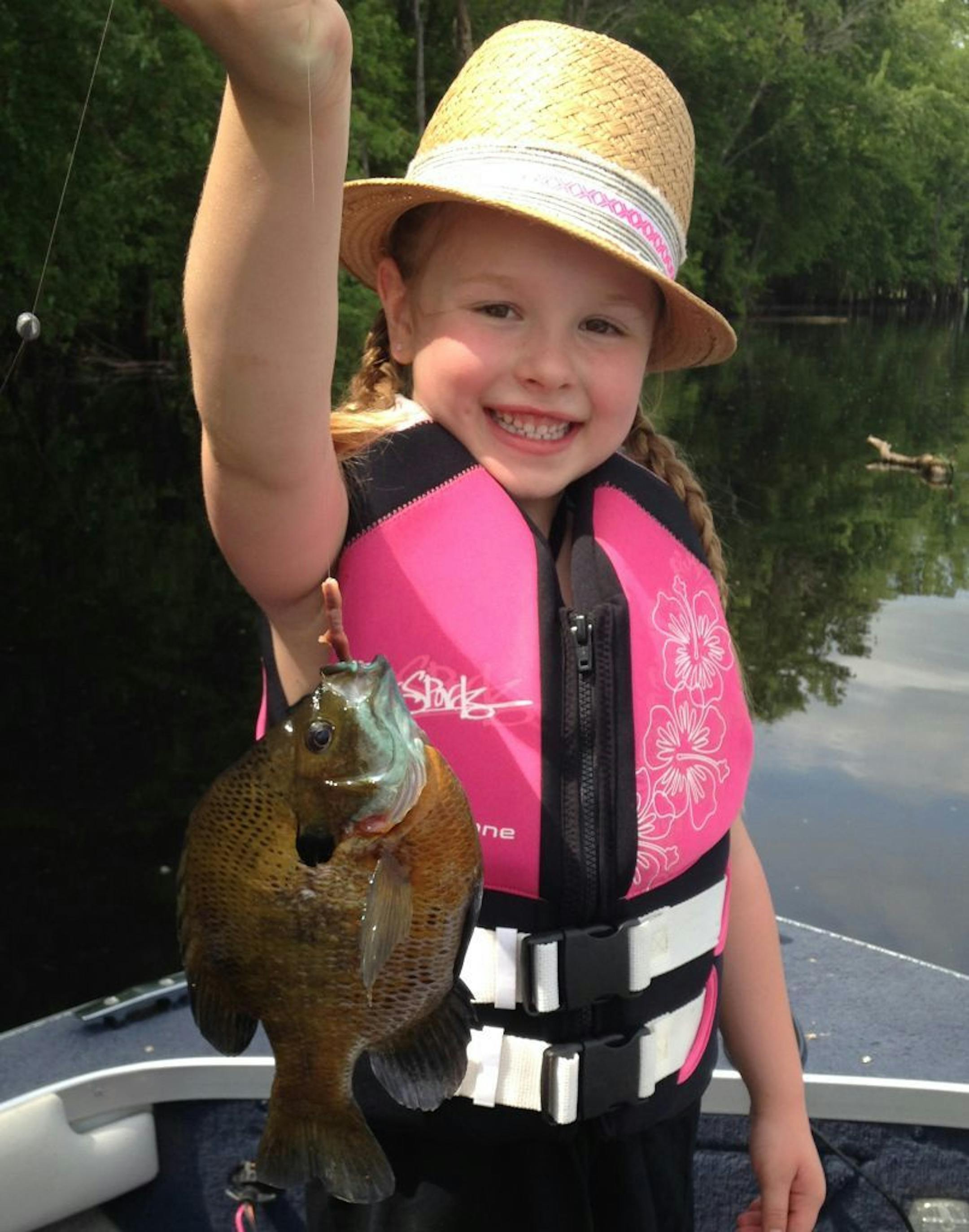 BIG SUNNIE Khloe Knudson, 5, of Andover, caught this 9 ½-inch sunfish on a night crawler on Lake Peltier in Lino Lakes while fishing with Grandpa Don Nyland of Blaine. "She could barely reel the fish in because it fought so hard!'' said Grandma Patty Nyland.