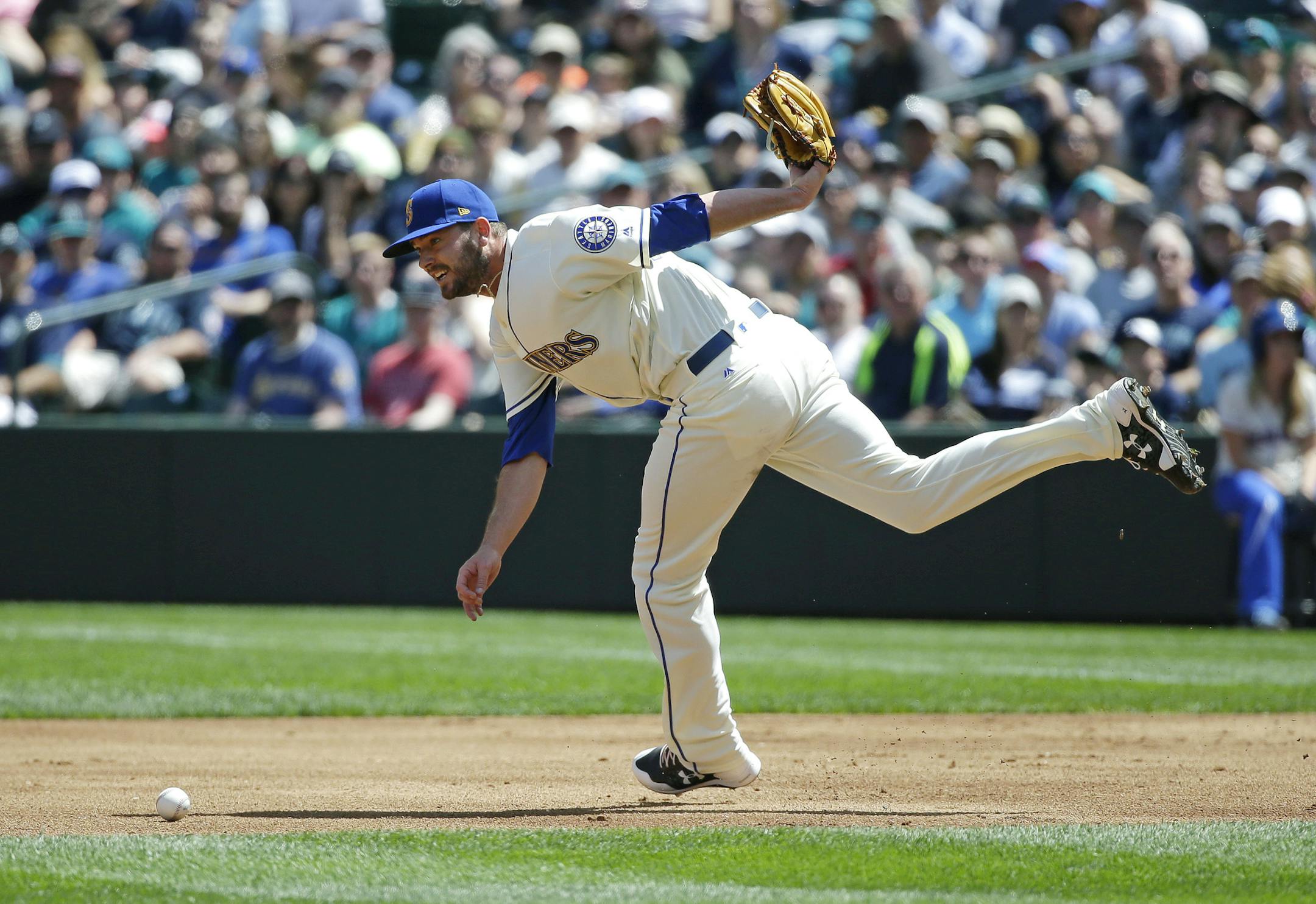 Seattle Mariners starting pitcher Chris Heston tries to recover after he could not pick up a soft ground ball hit by Chicago White Sox's Tim Anderson for an RBI-single in the first inning of a baseball game, Sunday, May 21, 2017, in Seattle. (AP Photo/Ted S. Warren)