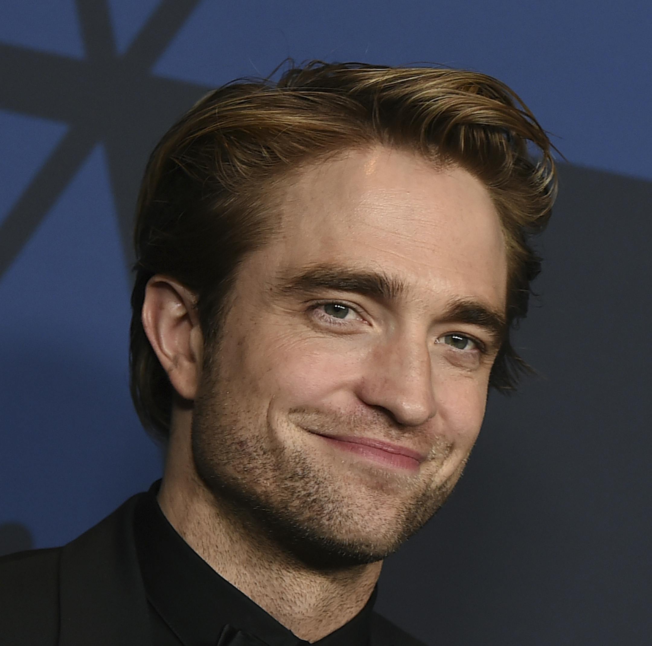 FILE - This Oct. 27, 2019 file photo show actor Robert Pattinson at the Governors Awards in Los Angeles. Warner Bros. is delaying a batch of releases including "The Batman" and "The Sopranos" prequel "The Many Saints of Newark." The studio said Monday, April 20, 2020 that "The Sopranos" film will be pushed from September 2020 to a March 2021 release, while "The Batman" starring Pattinson will be delayed four months to October 2021. (Photo by Jordan Strauss/Invision/AP, File)