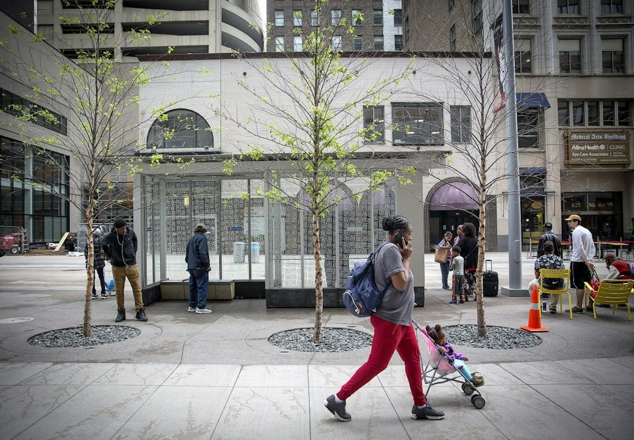 Pedestrians made their way along Nicollet Mall where the trees on the newly redesigned area are dying en masse, Wednesday, June 6, 2018 in Minneapolis, MN. The city may have to replant them because they're dying so quickly.