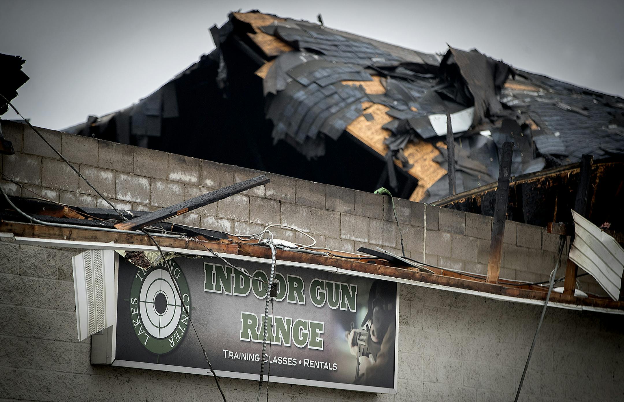 The remains of a fire that destroyed Lakes Trading Company New and Used Guns, Tuesday, March 27, 2018 in Forest Lake, MN. ] ELIZABETH FLORES ï liz.flores@startribune.com