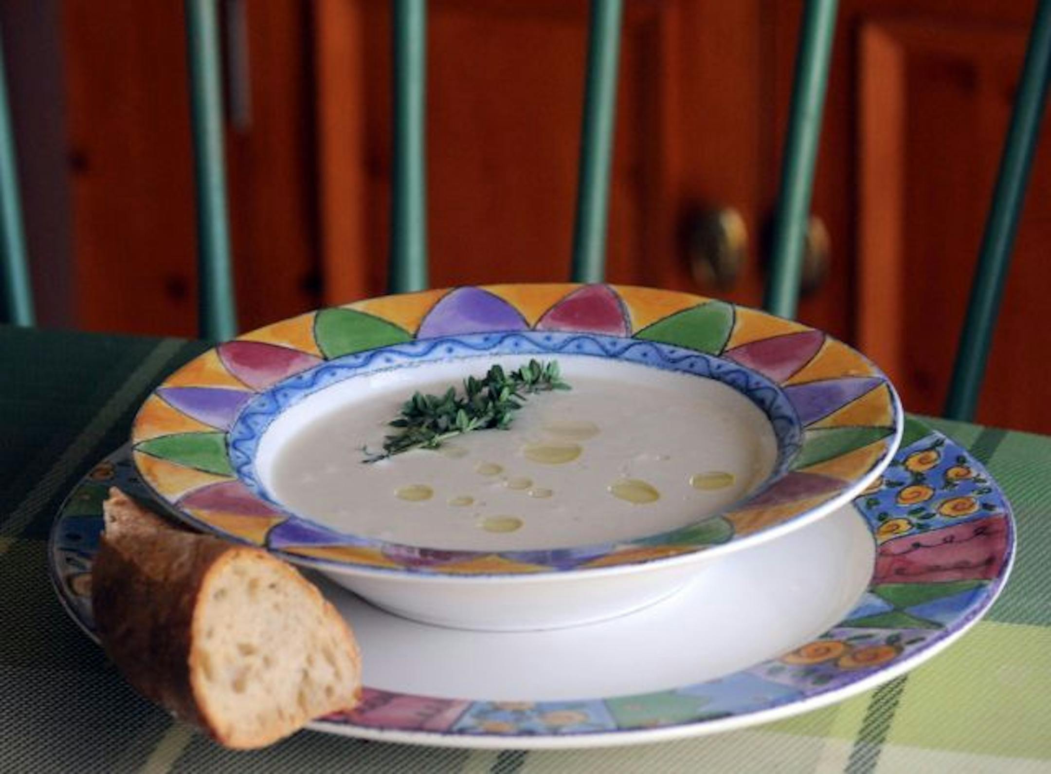 Cauliflower soup gets a drizzle of white truffle oil before serving.