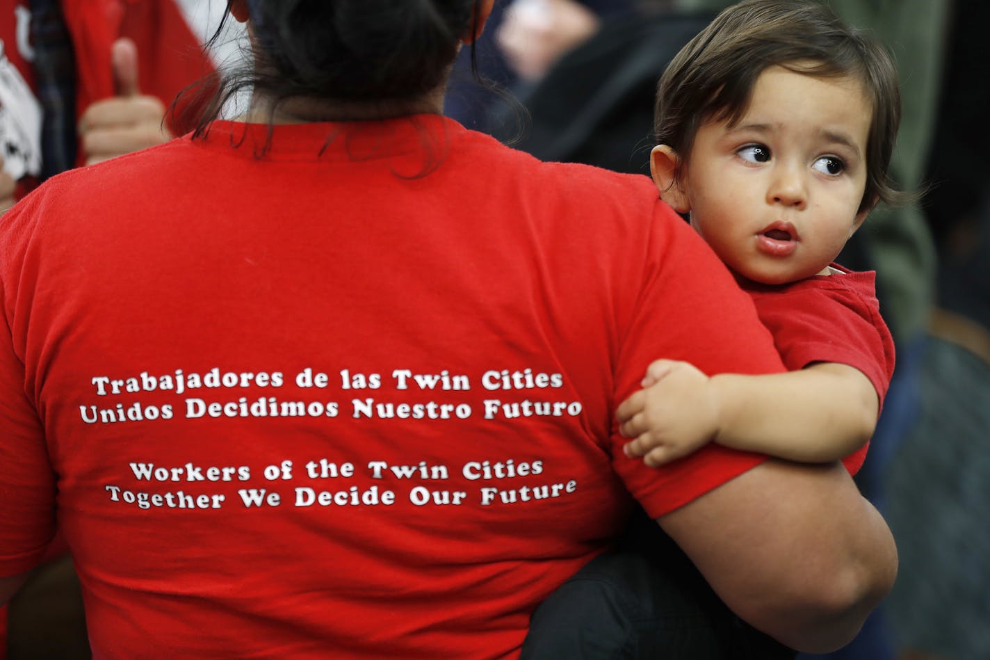 Veronica Mendez Moore held her 14-month hold son Teu Mendez Moore before the announcement that janitors who clean Target stores have won the right to organize under the SEIU Local 26 janitors union at the CTUL union hall Thursday October 13, 2016 in Minneapolis, MN. ] Jerry Holt / jerry. Holt@Startribune.com