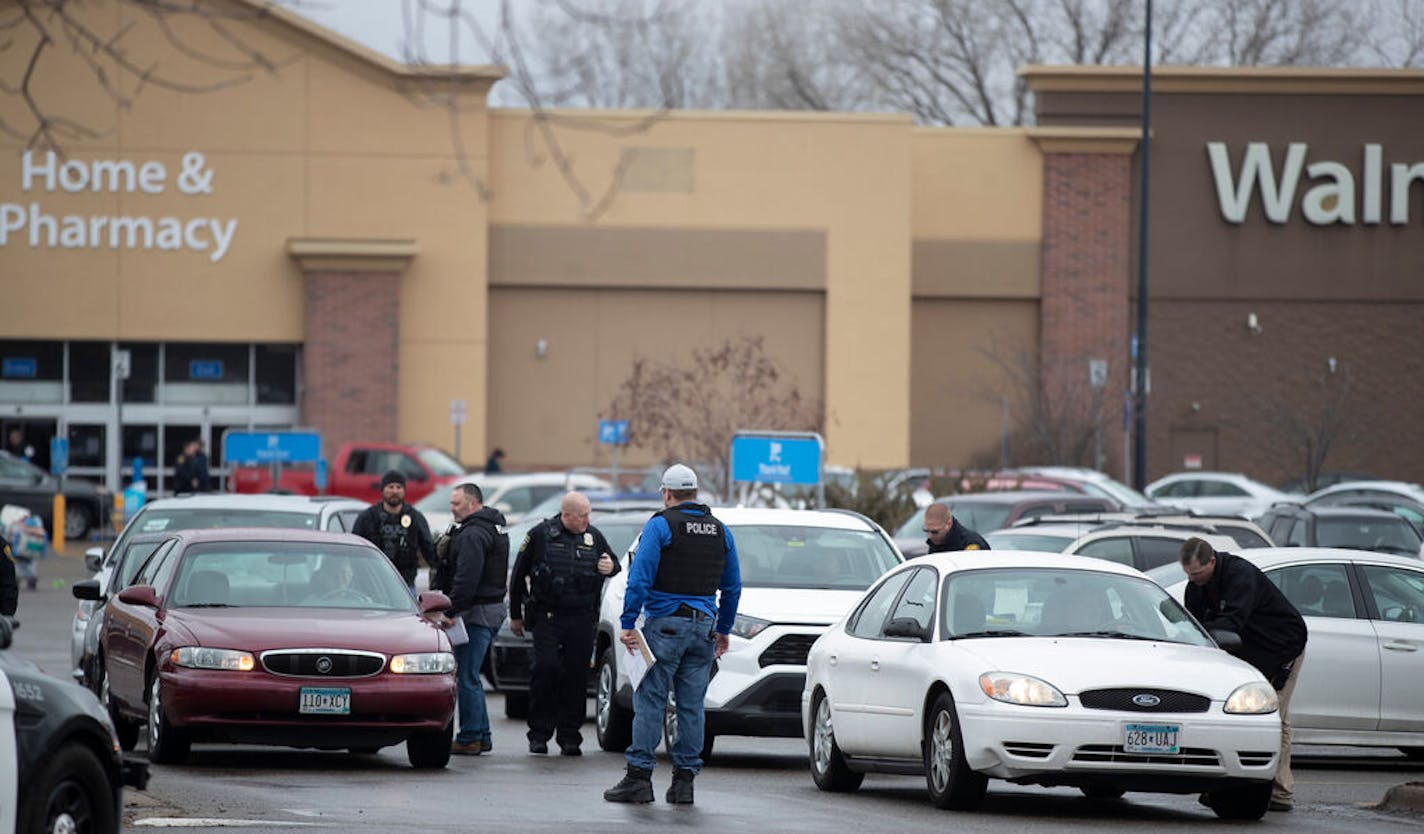 A police officers checked drivers as they left parking lot of the Brooklyn Park Walmart.] Jerry Holt •Jerry.Holt@startribune.com