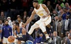 The Timberwolves Josh Okogie stole the ball during overtime as Golden State's Glen Robinson III attempted to cover