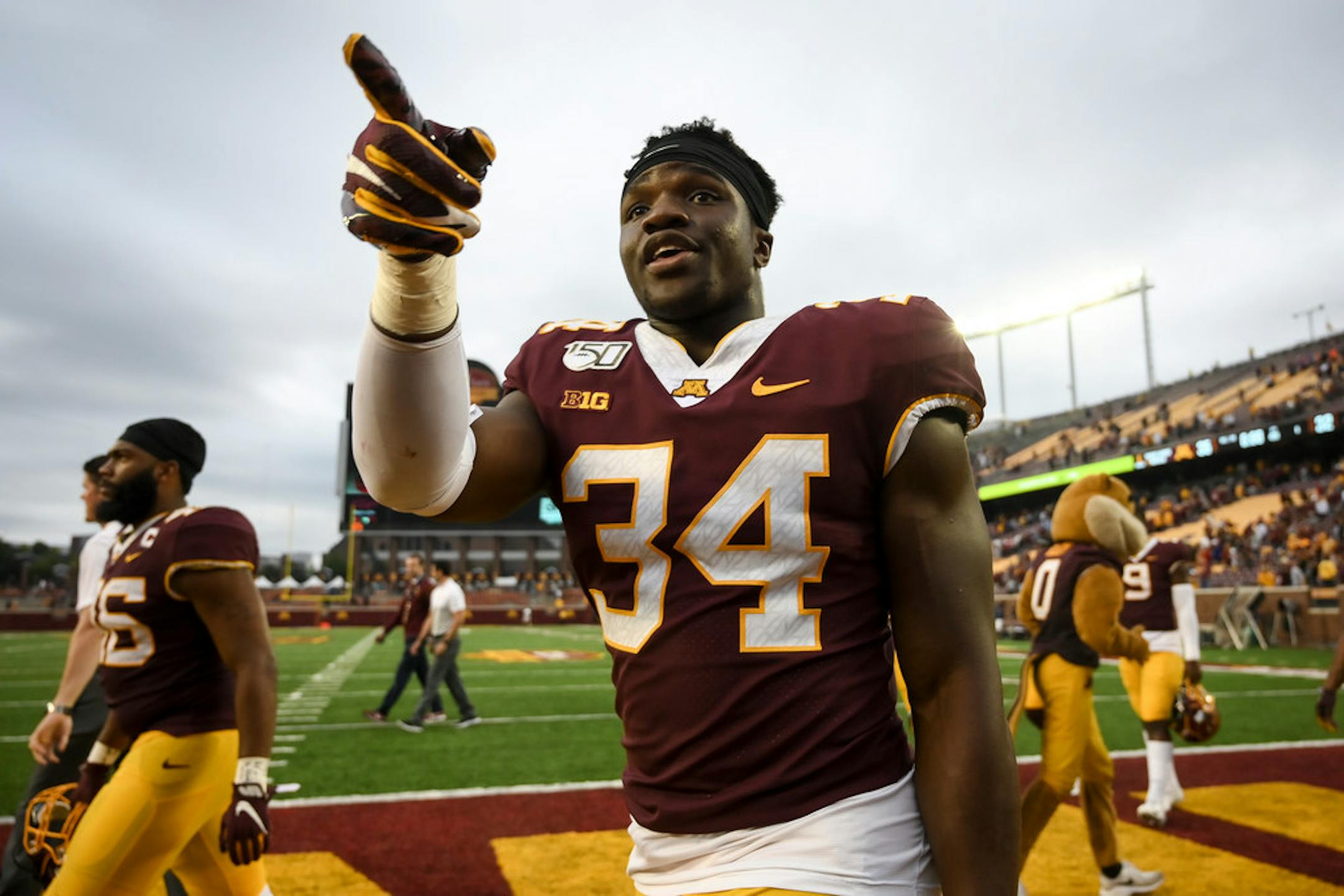Gophers defensive lineman Boye Mafe (34) gestured to fans after his team's win against the Georgia Southern Eagles earlier this season.