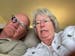 Portrait of Dick and Polly Bramer in which Dick is wearing glasses with a small device on the right lens.