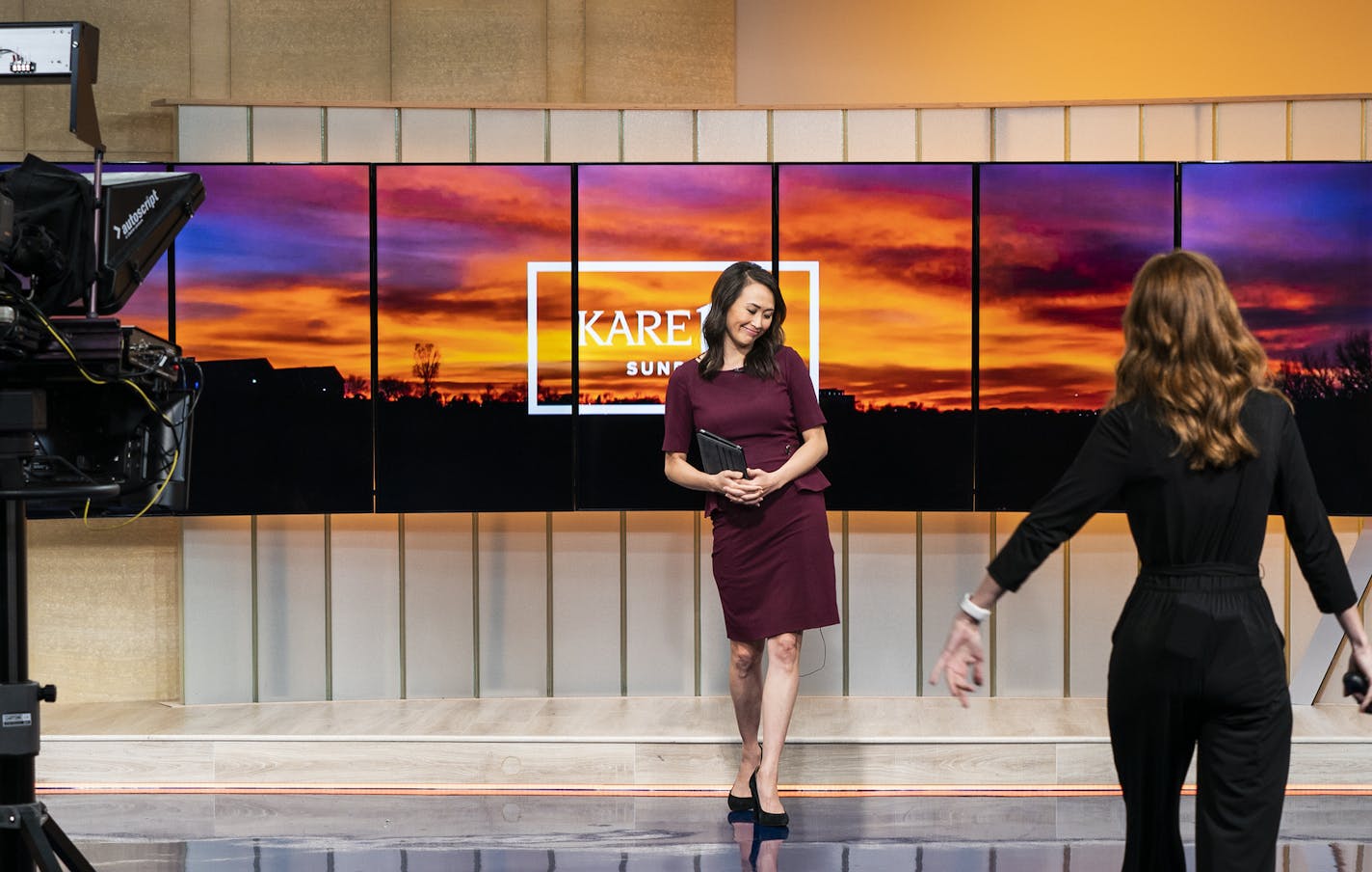 Gia Vang greets Ellery McCardle, right, during the sunrise newscast. ] LEILA NAVIDI &#x2022; leila.navidi@startribune.com BACKGROUND INFORMATION: Gia Vang of KARE 11, the first Hmong-American anchor in the Twin Cities, does the 5 a.m. newscast at the KARE 11 studios in Golden Valley on Friday, July 26, 2019.