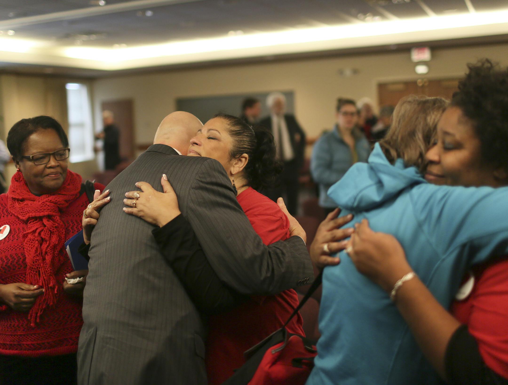 Here, following the Memorial event, many of those attending gave out hugs to several local mothers who had lost children to gun violence, including Cindy Kennedy, right, who in 2011 lost her son Quantell Braxton, 14; Angel Cradle, middle, who in 2007 lost her son Duane Tyson Sr., 34; and Mary Johnson, left, who lost her son Laramuin Byrd in 1994, Saturday, Dec. 14, 2013, at Westminister Presbyterian Church in Minneapolis, MN.](DAVID JOLES/STARTRIBUNE) djoles@startribune.com Moms Demand Action fo