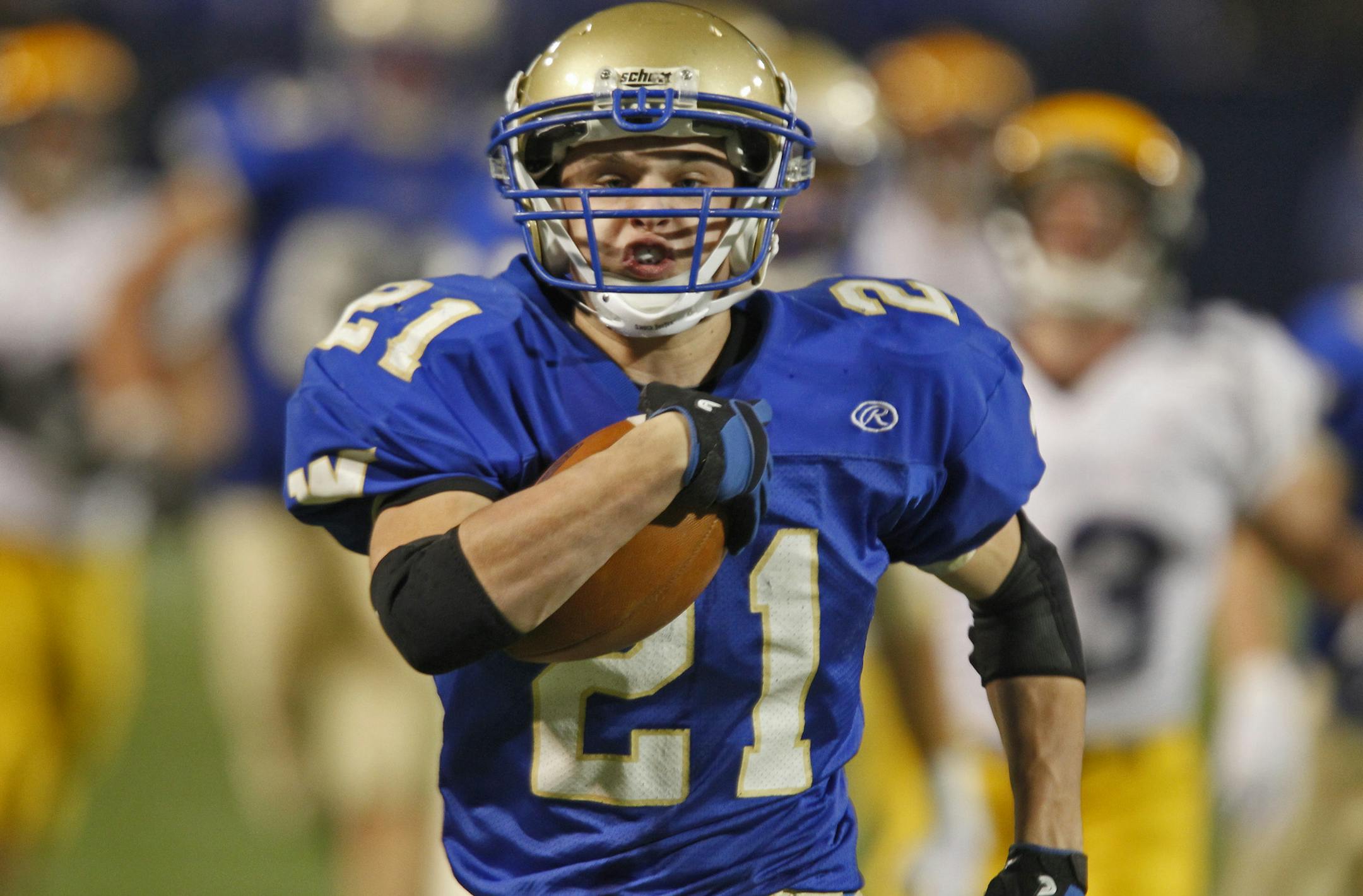 ]MARLIN LEVISON*mlevison@startribune.com - Prep Bowl Final - 5A - Wayzata vs. Rosemount. IN THIS PHOTO: .Wayzata's Mitchell Underhill left a blur of of Rosemount defenders behind him as he scooted some 50 yards for his second of three touchdowns in the game.