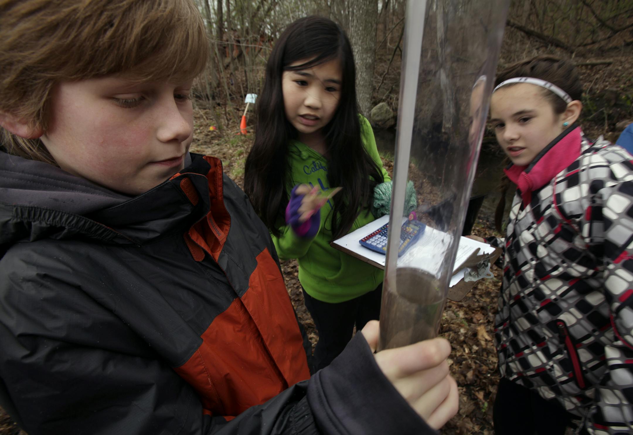 Left to right: Will Gilbert (orange coat), Lynh Tran (green), and Keely Heinrich (black and white jacket) work on an environmental experiment involving the clarity of the stream at Jeffers Pond Elementary in Prior Lake, MN on May 9, 2013. ] JOELKOYAMA‚Ä¢joel koyama@startribune.com MAGIC SAXO NUMBER IS 644715 The Prior Lake-Savage district was one of 14 districts to win the national Green Ribbon Schools award given by the U.S. Department of Education last month. An elementary sch