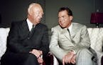 President Dwight D. Eisenhower seated with Vice Pres. Richard Nixon in November 1952. (AP Photo) ORG XMIT: APHS301001