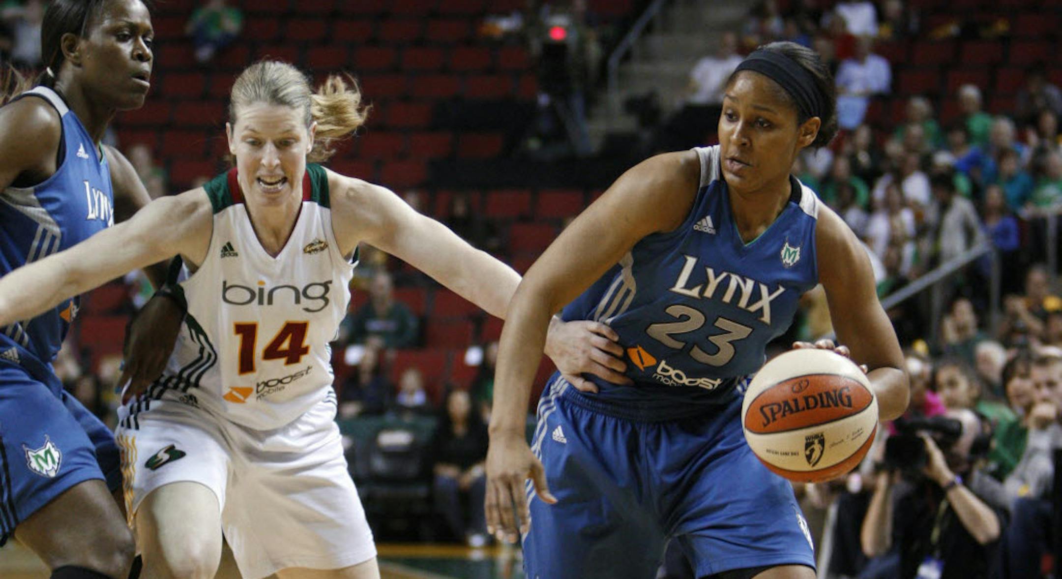The Lynx's Maya Moore, right, got a pick from Taj McWilliams-Franklin as she drove against Seattle's Katie Smith.